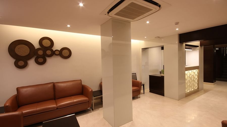 view of the lobby area with comfortable chairs and warm lights at Khanna Fiesta, Vellore