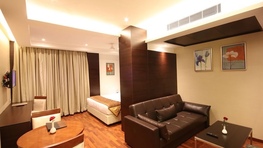 overview of a room with living room and a king size bed of a room at Khanna Fiesta, Vellore