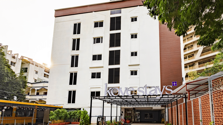 Facade of Kove Smat Stays seen during the day, highlighting its multi-storey building, entryway and extended portico.