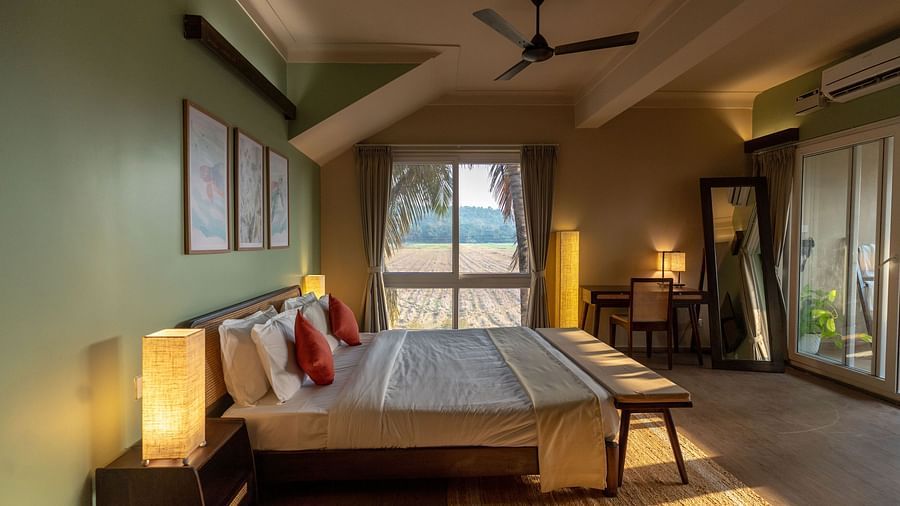Elegant room featuring king size bed, modern furniture, and calming green interiors at Kssemya.