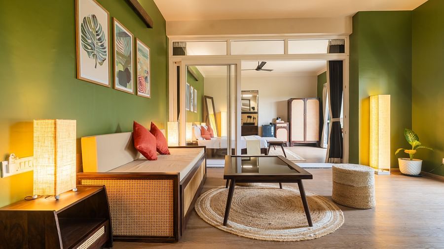 Open-plan suite with a cosy lounge, ambient lighting, and curated decor at Kssemya.