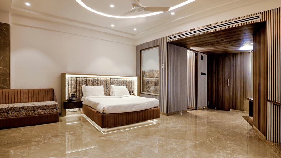 A room with spacious interiors and comfortable bedding at Kumar Resort by Turtle.