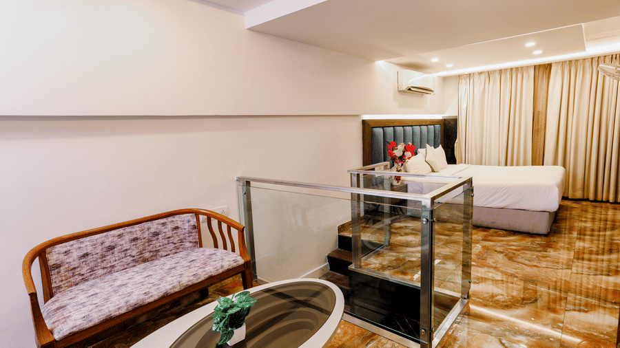 Room with a cosy seating area and modern interiors at Kumar Resort by Turtle.