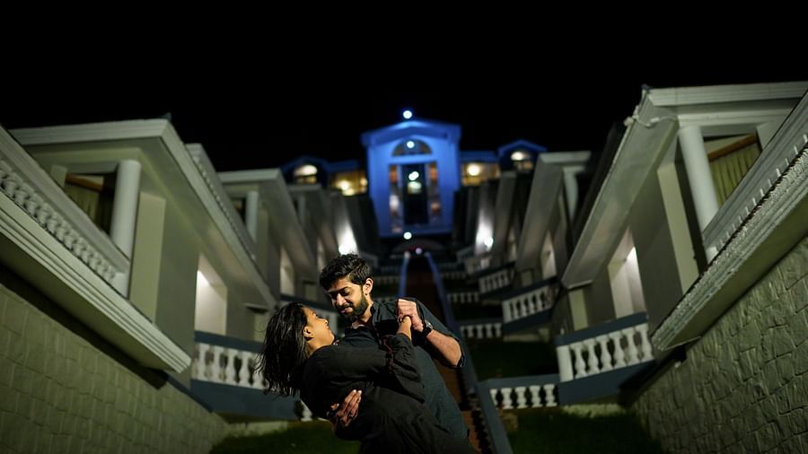 a man holding woman in the stairs of La Montana By TGI, Ooty