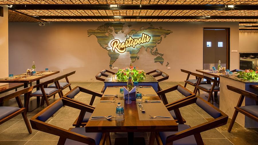 Interior of Roastopolis Restaurant at Le Foliage by TGI, Bangalore where tables and chairs are well aligned