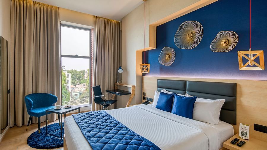 Side view of the double bed at the Premium Room at Le Foliage by TGI, Bangalore