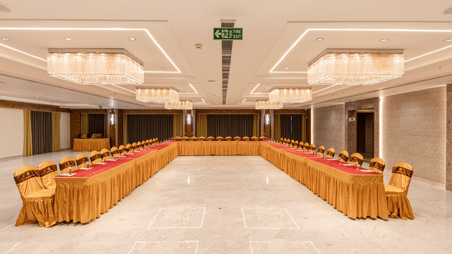Long table U style event seating in banquet hall at Lemonridge Hotels, IDPL Balanagar.