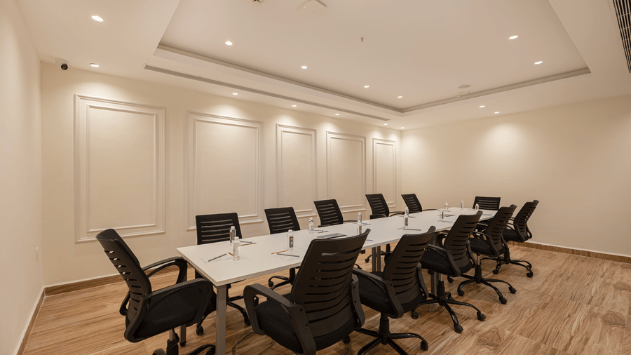 Professional meeting room with ample lighting and seating for corporate discussions at Lemonridge Hotels, IDPL Balanagar.