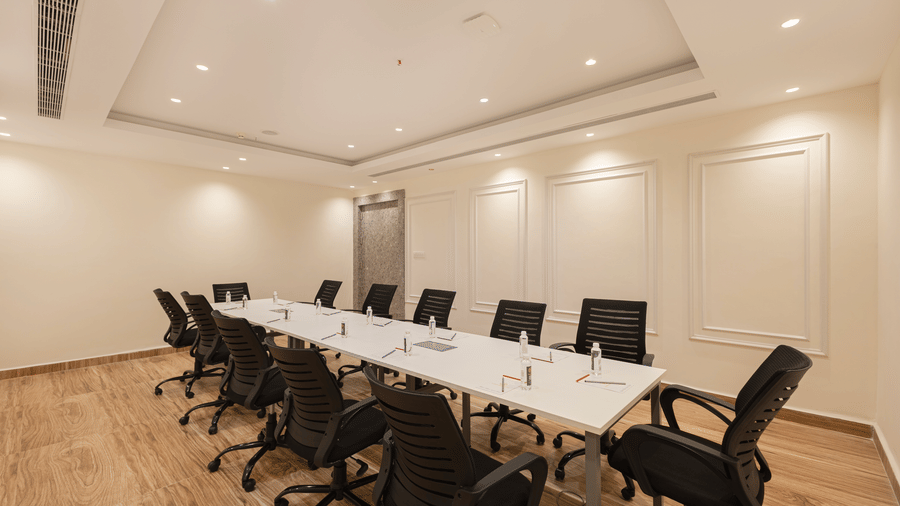 A corner view of the boardroom seating arrangement near the entrance at Lemonridge Hotels, IDPL Balanagar.