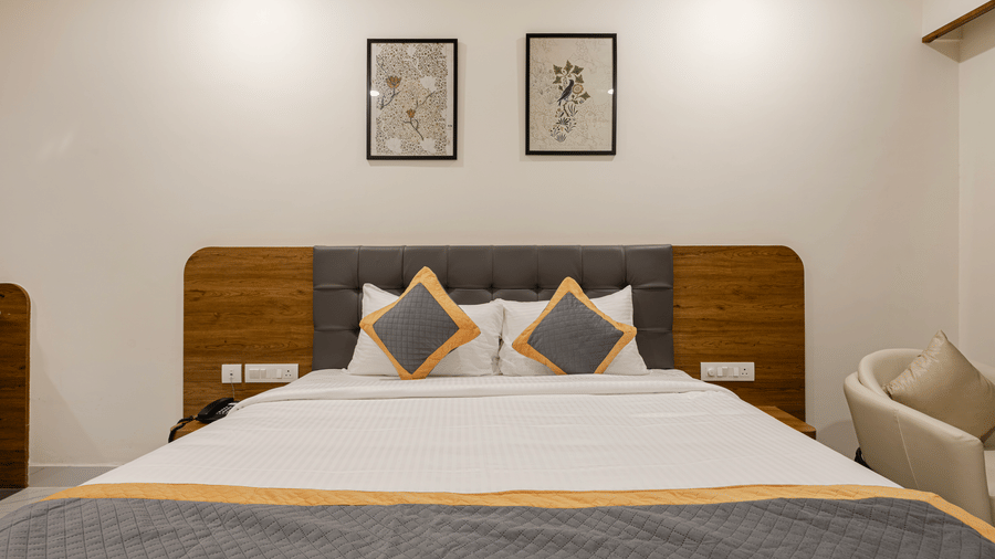 Family-friendly room with a king size bed and modern amenities at Lemonridge Hotels, IDPL Balanagar