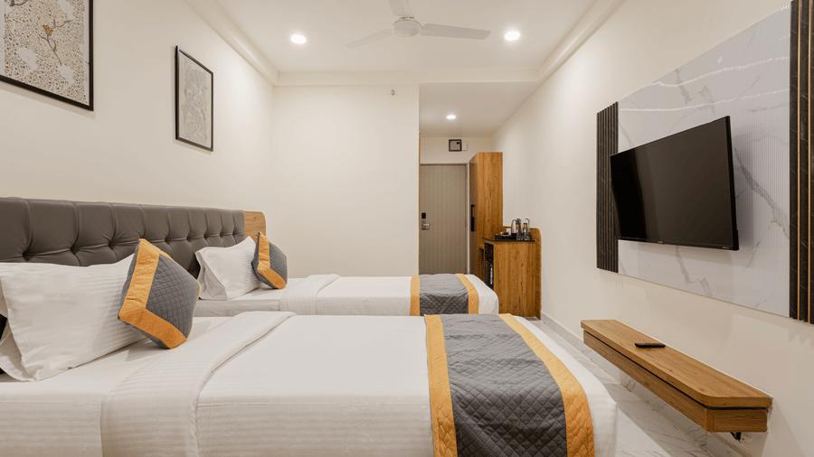 Stylish cosy twin room with twin beds and warm lighting at Lemonridge Hotels, IDPL Balanagar