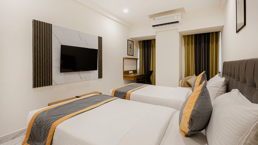 Bright twin bedroom with light and contemporary design at Lemonridge Hotels, IDPL Balanagar