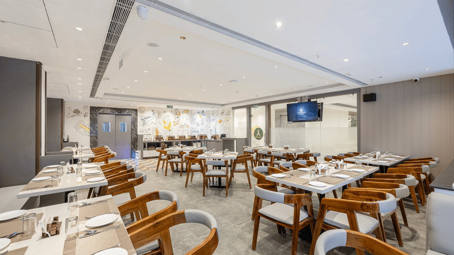 Bright and spacious restaurant seating area at Lemonridge Hotels, IDPL Balanagar
