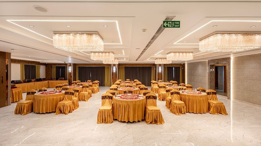 Banquet hall in round table setup with elegant décor at Lemonridge Hotels, IDPL Balanagar.