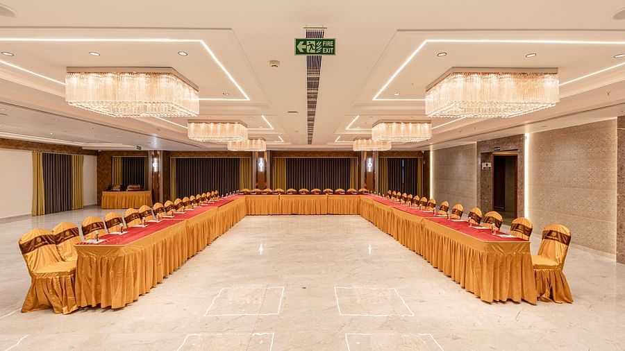 Long table U style event seating in banquet hall at Lemonridge Hotels, IDPL Balanagar.