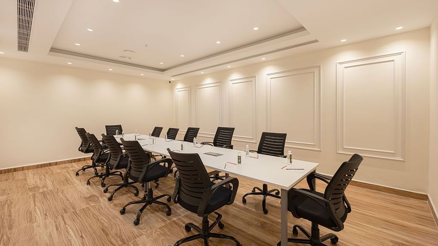 Spacious boardroom with executive chairs arranged in a U-shape at Lemonridge Hotels, IDPL Balanagar.