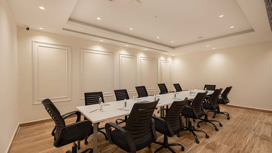Professional meeting room with ample lighting and seating for corporate discussions at Lemonridge Hotels, IDPL Balanagar.