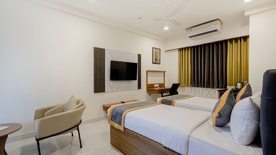 Twin-bed room with clean design and modern amenities at Lemonridge Hotels, IDPL Balanagar.
