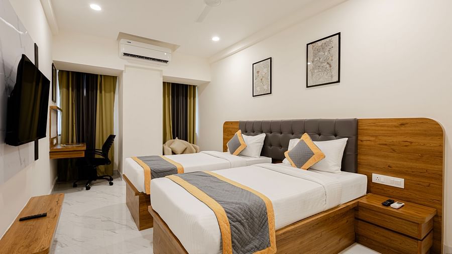 Stylish cosy twin room with twin beds and warm lighting at Lemonridge Hotels, IDPL Balanagar