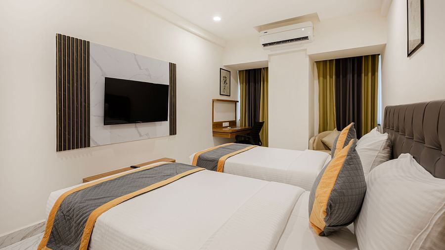 Bright twin bedroom with light and contemporary design at Lemonridge Hotels, IDPL Balanagar