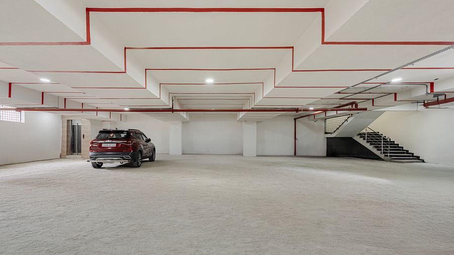 Underground parking area with marked bays at Lemonridge Hotels, IDPL Balanagar.