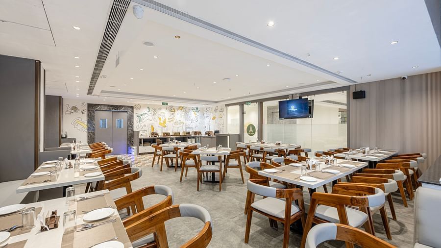 Bright and spacious restaurant seating area at Lemonridge Hotels, IDPL Balanagar