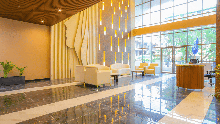 The seating area and reception desk in the lobby of Livbox, Dehradun.