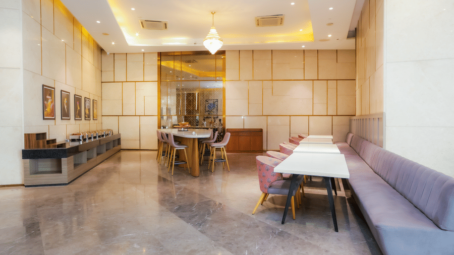 Spacious restaurant corner with cosy seating arrangements at Livbox Supernova, Noida.