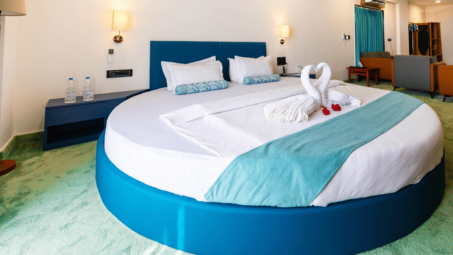 Round bed bedroom with stylish interiors and soft lighting at Lords SKD Resort, Salangpur.