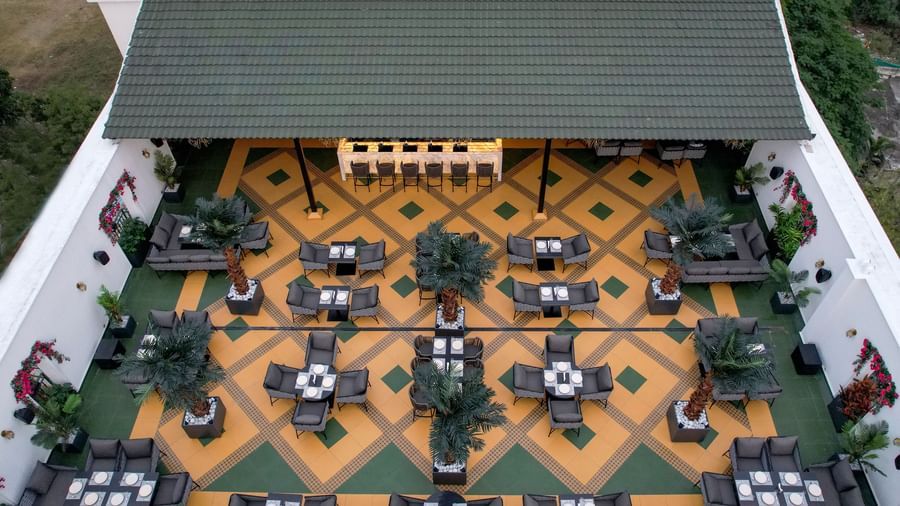 Aerial view of the Sky Roof highlighting the vibrant tiles and nicely arranged dining tables at M2 Square by Monday Premium.