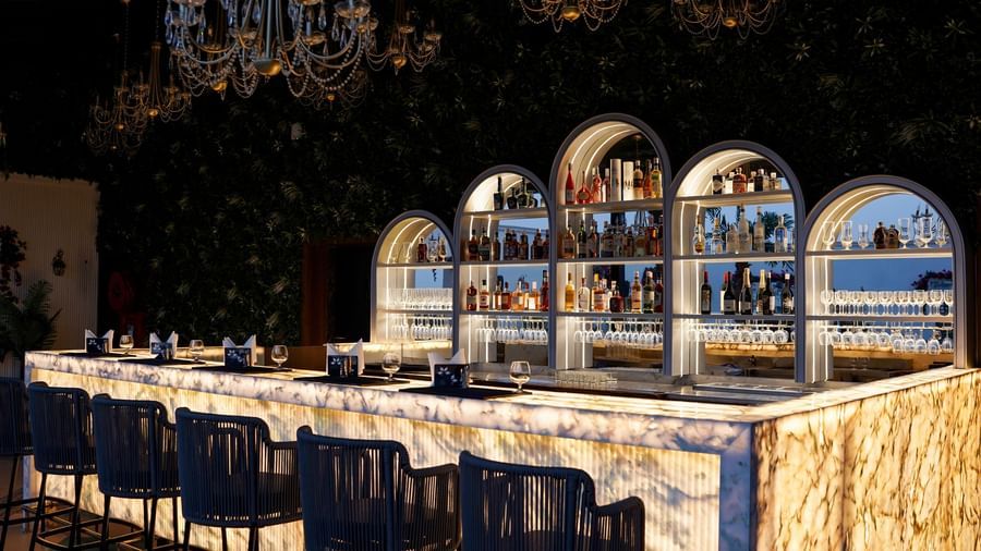 Corner view shot of the bar counter featuring an extensive collection of premium liquor for display at the Sky Roof at M2 Square by Monday Premium.