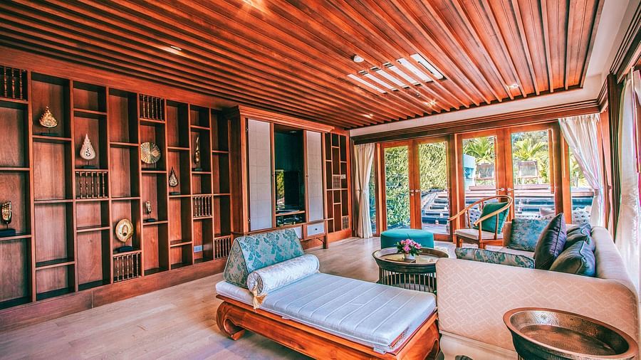corner view of the living area featuring a beautiful compartmentalised wall with modern artefacts - three bedroom private pool villa