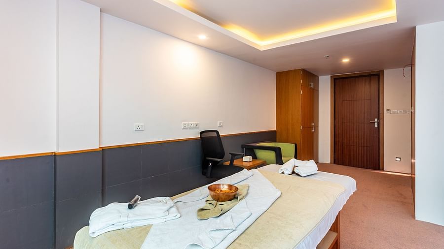A Large spa table at the centre of a room on which towels are placed at Mandala Norling Lords Prime in Kathmandu.