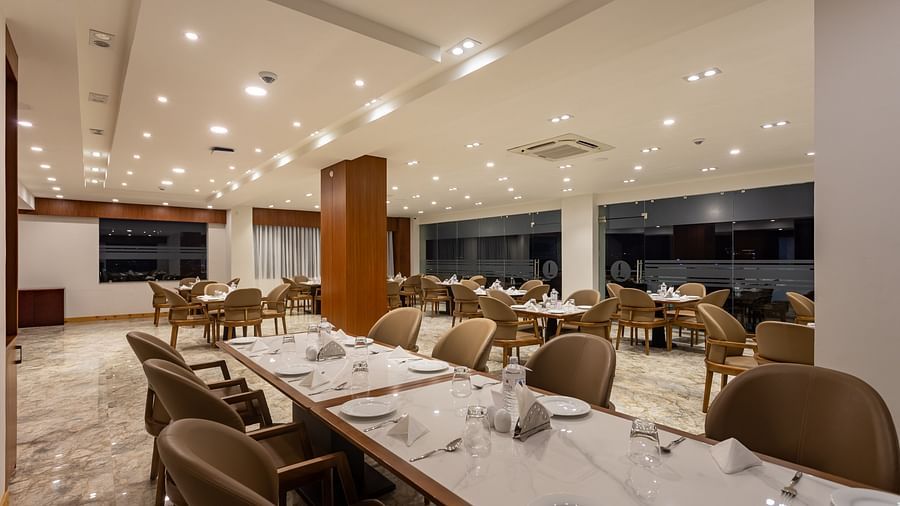 The Blue Coriander restaurant at Mandala Norling Lords Prime in Kathmandu featuring a fine dining seating arrangement and well-placed cutlery.