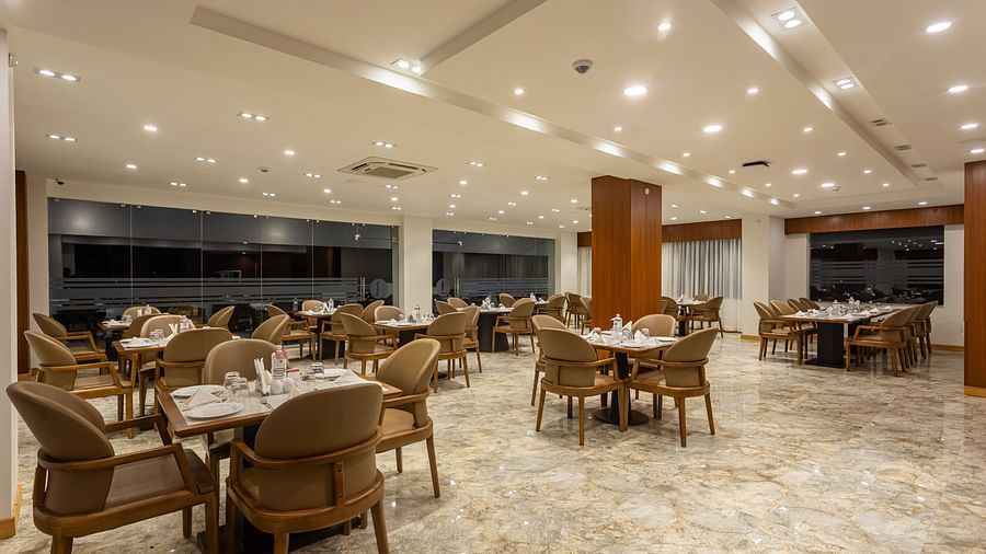 The Blue Coriander restaurant at Mandala Norling Lords Prime in Kathmandu featuring a fine dining seating arrangement and well-placed cutlery.