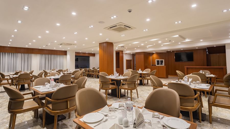 Close view of The Blue Coriander restaurant at Mandala Norling Lords Prime in Kathmandu featuring a fine dining seating arrangement and well-placed cutlery.