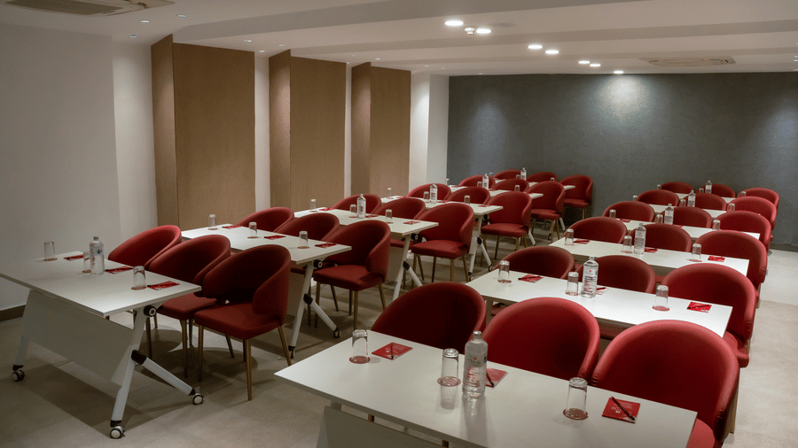 Classroom-style seating with red chairs at Mandala Norling Lords Prime Kathmandu.