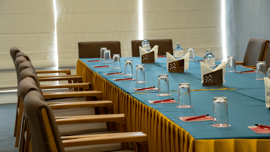 Conference table with teal cloth and seating arrangement at Mandala Norling Lords Prime Kathmandu.