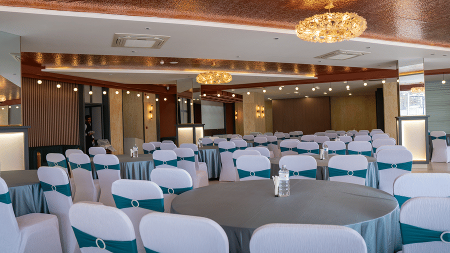 Event hall with round tables and stage lighting at Mandala Norling Lords Prime Kathmandu.