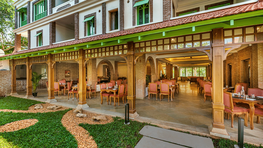 Lush outdoor seating area at Mango Hill Auroville resort