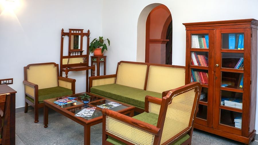 Sofas and a book shelf in the RECEPTION LOBBY at Mango Hill La Serene, Pondicherry
