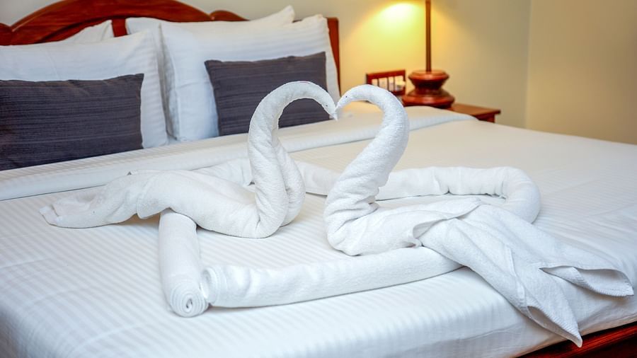 Two swans made outof towels on a bed | Mango Hill La Serene, Pondicherry