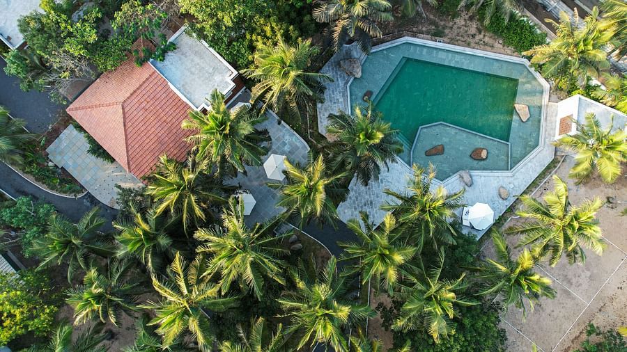 Aerial view of a private beach resort near Pondicherry with a swimming pool | Mango Hill Shallow Beach Resort ECR