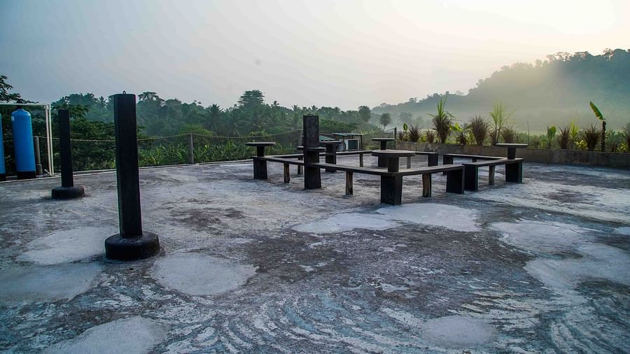Outdoor seating area bathed in warm morning light - Matsya Island Retreat by Island Quest.