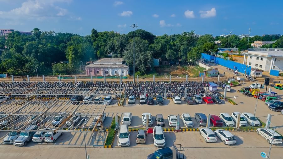 Outdoor parking area with multiple vehicles near Max Hotel Prayagraj.