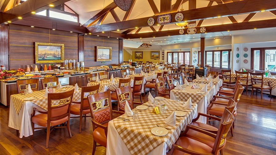 indoor seating space at the restaurant - Mayfair Hill Resort, Darjeeling