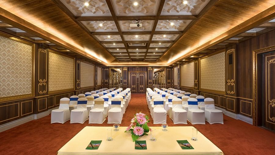 a frontal view of the indoor seating space of the conference hall - Mayfair Himalayan Spa Resort Kalimpong 1
