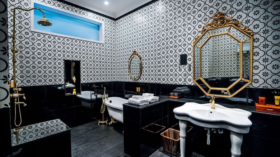 the bathroom with a wash basin and a bathtub at the right side - Mayfair Tea Resort, Siliguri