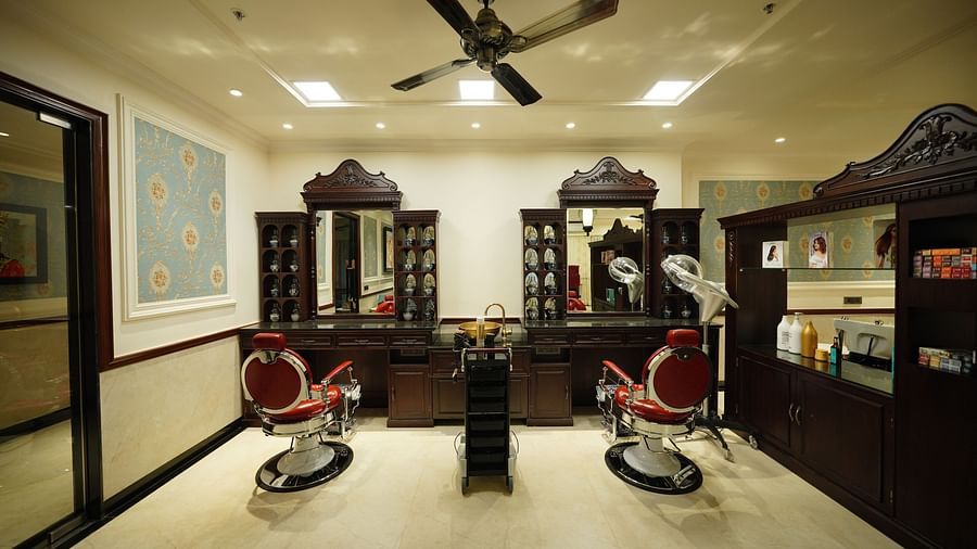 two mirrors and two rolling salon chairs - Mayfair Tea Resort, Siliguri 1