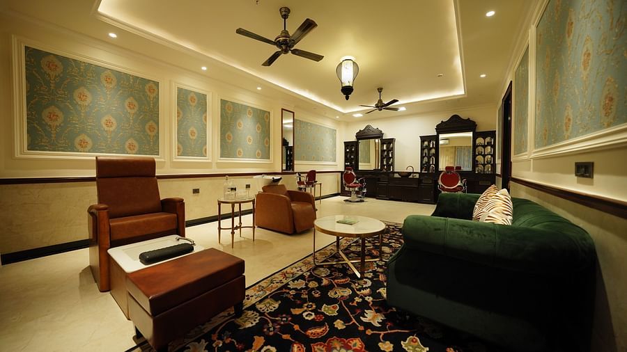 two sofas, one with a pedicure basin and a hair wash basin - Mayfair Tea Resort, Siliguri